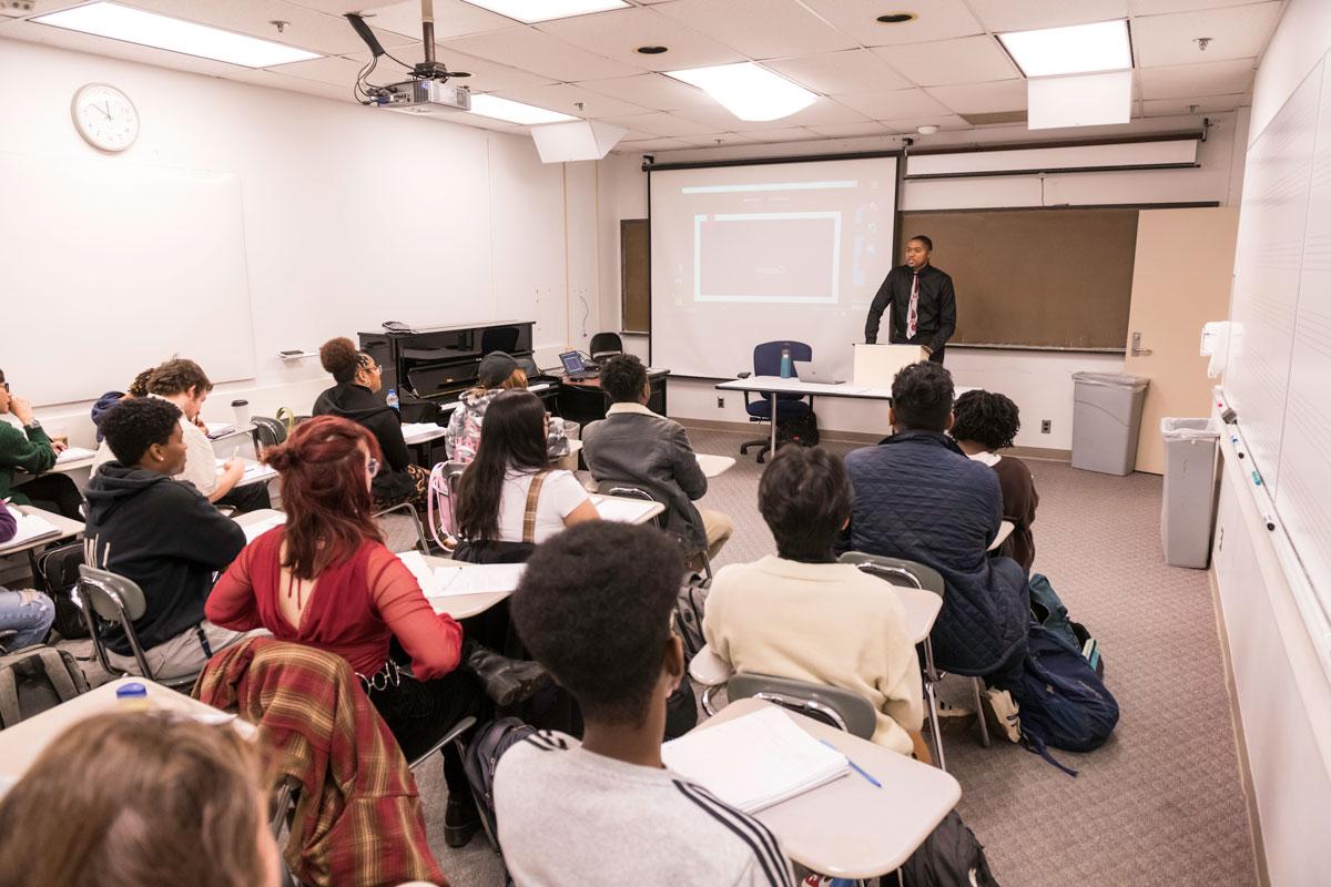 Cory Hunter ’06 (ESM), an assistant professor of musicology at Eastman School of Music and an assistant professor of music at the University of Rochester, leads his class